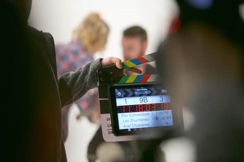person-holding-clapperboard