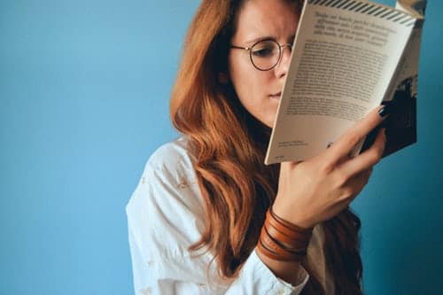 woman-wearing-eyeglasses-holding-a-book